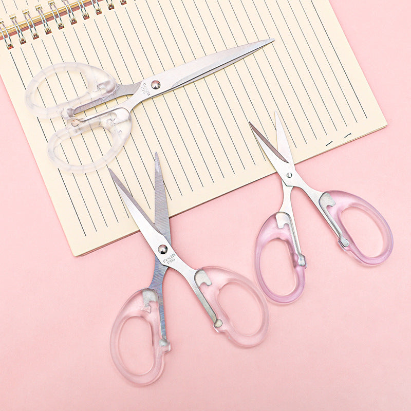 close-up of sharp blade and clear handle scissors