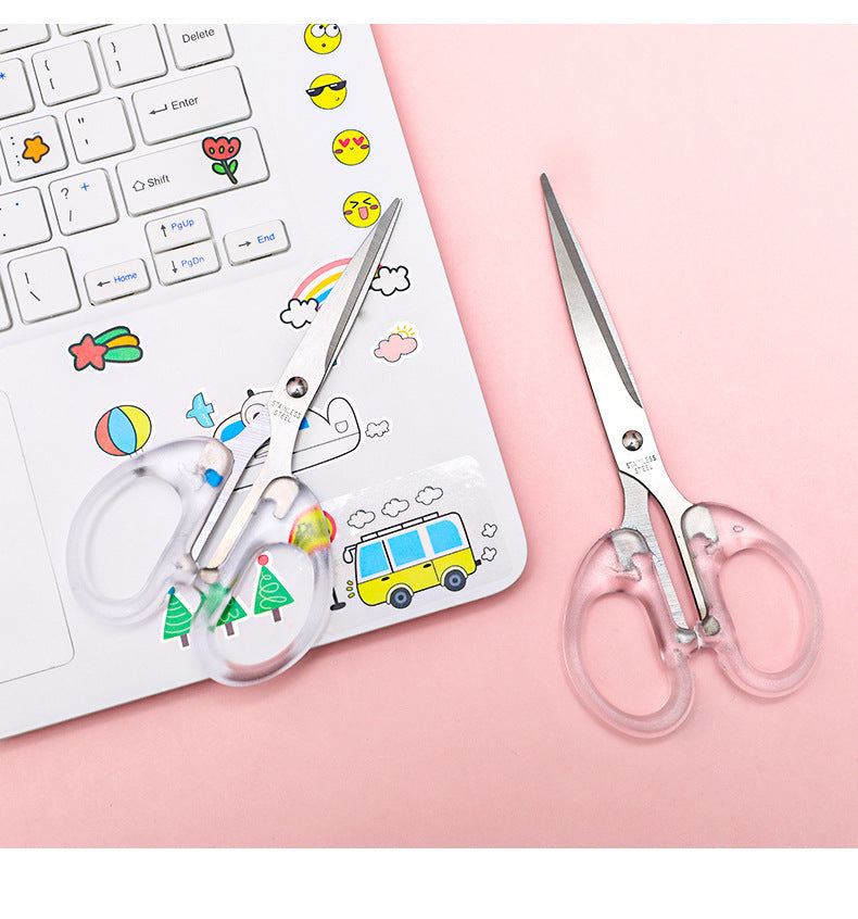 close-up of sharp blade and clear handle scissors