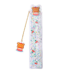 Detailed view of cake bear charm on ruler
