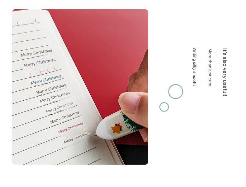Close-up of Christmas-themed pens featuring Santa Claus