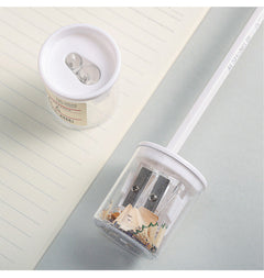 Compact pencil sharpener with coloured pencils