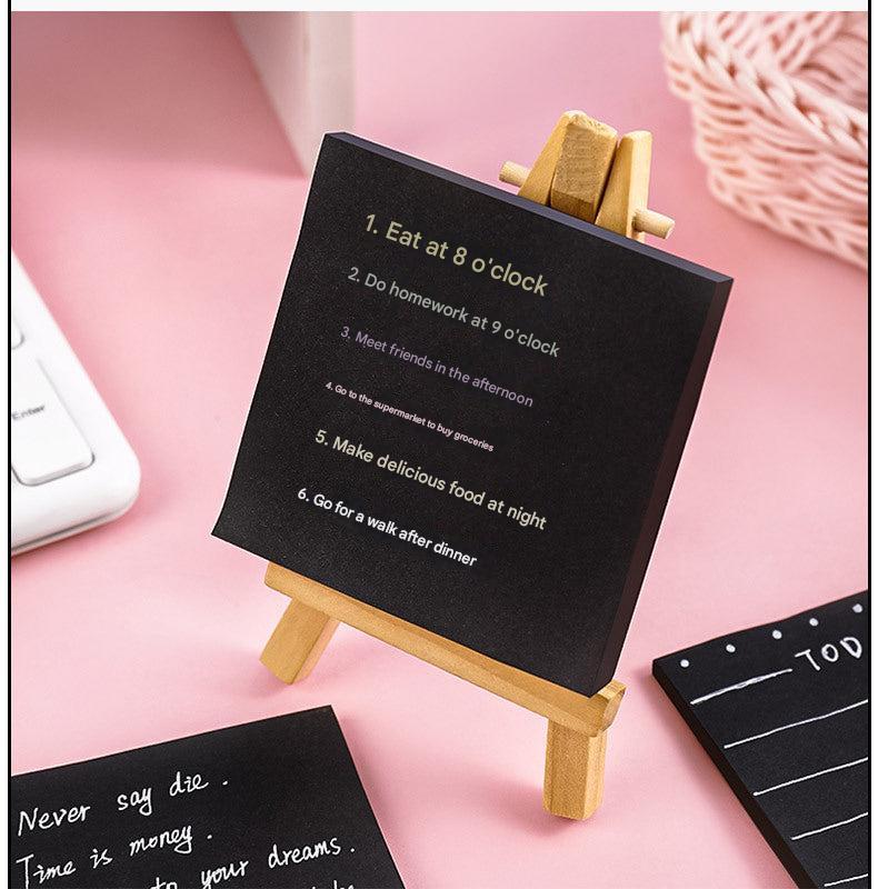 Black sticky notes pack displayed on table