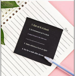 Compact black sticky notes displayed