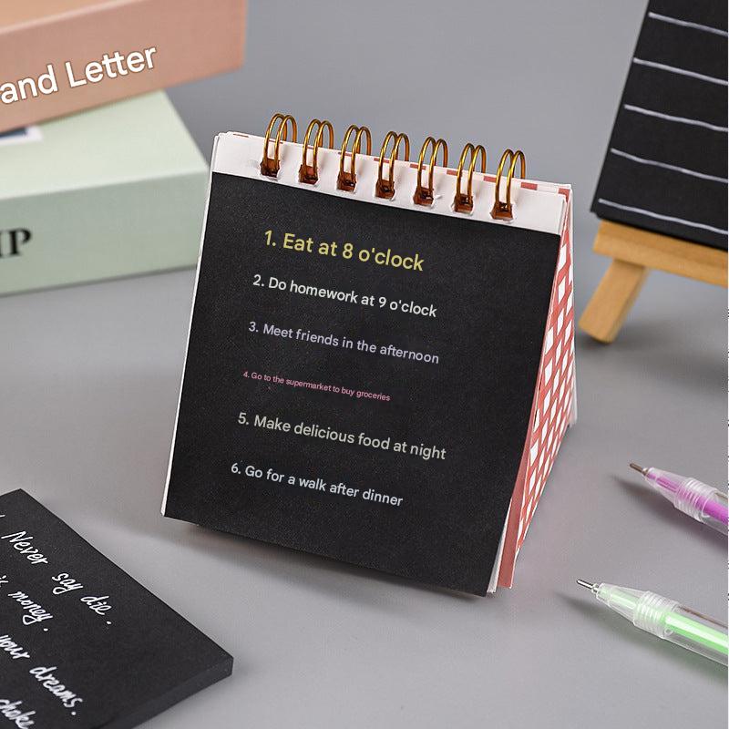 Student using black sticky notes in class
