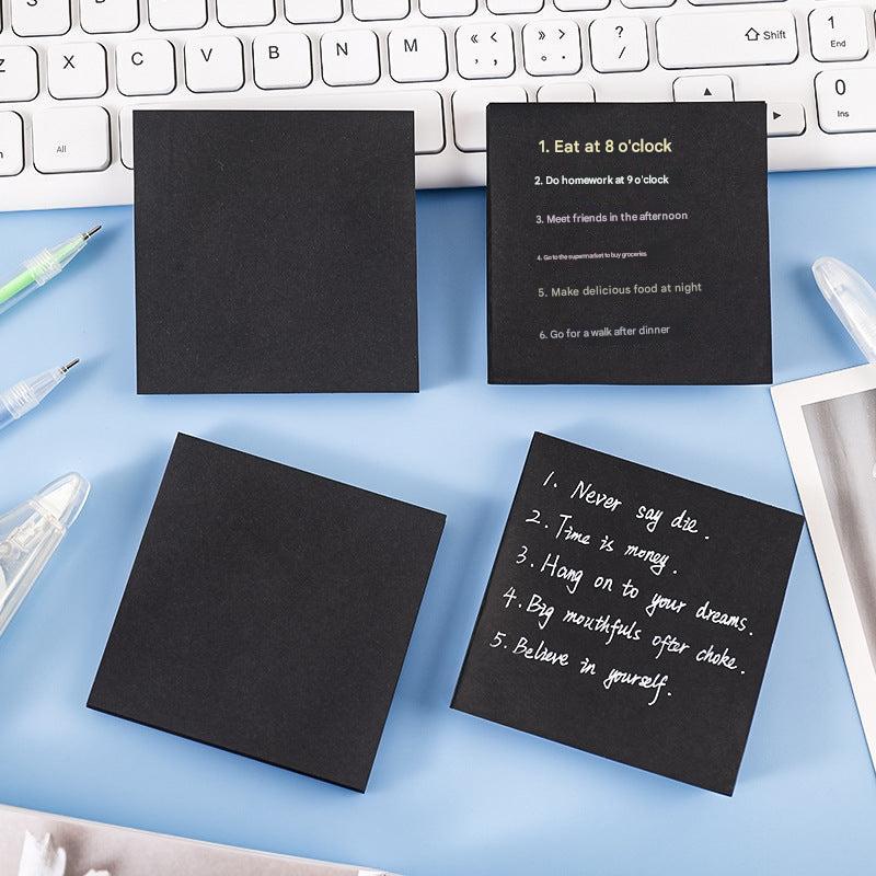 Black sticky notes pack displayed on table
