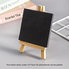 Compact black sticky notes displayed