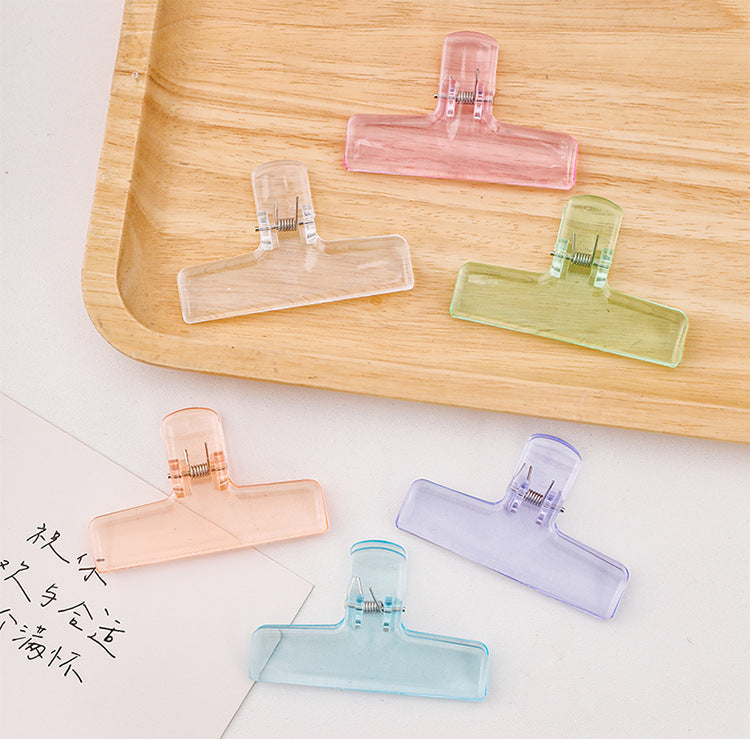 Stacked acrylic clipboards displaying transparency