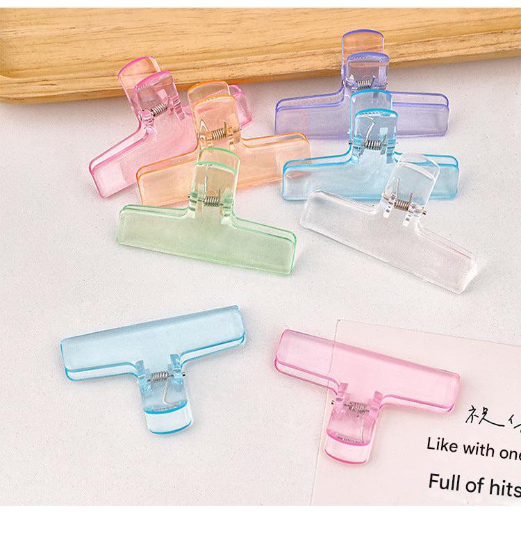 Stacked acrylic clipboards displaying transparency
