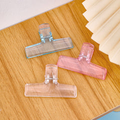 Stacked acrylic clipboards displaying transparency