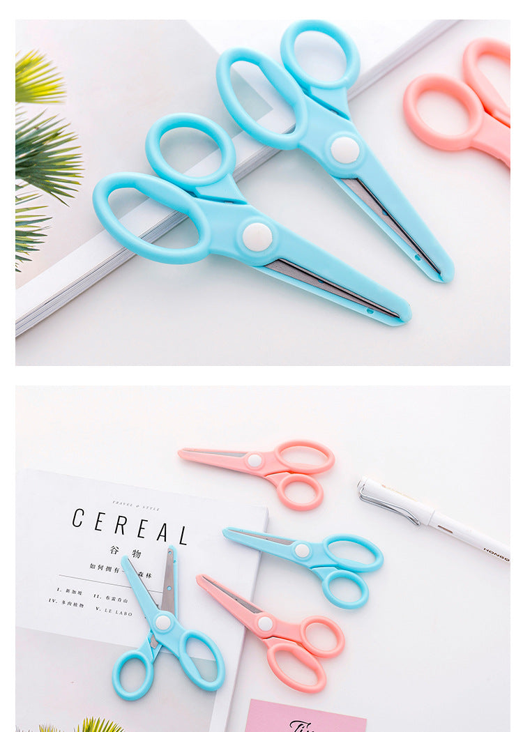 Child using ergonomic blue scissors