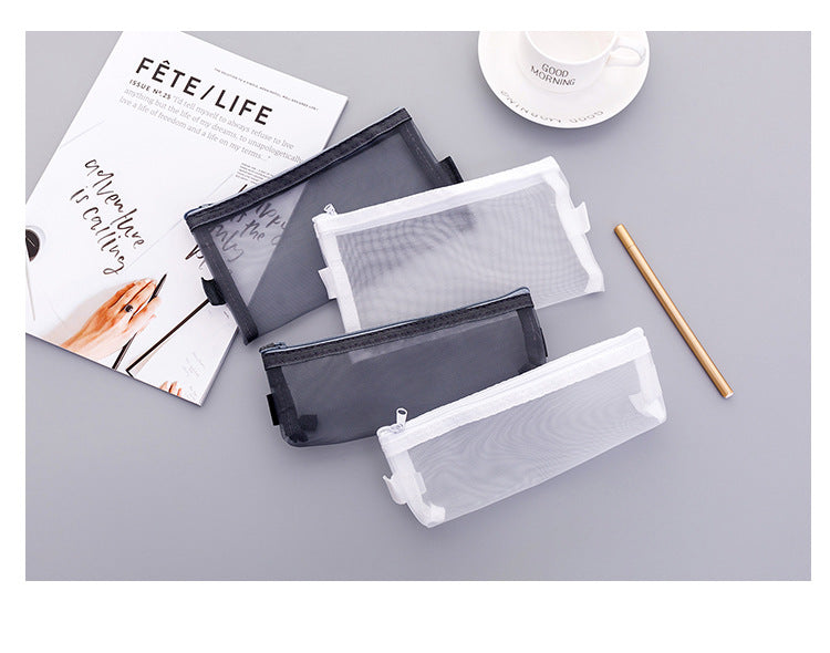 Small white mesh pencil case on table