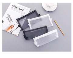 Small white mesh pencil case on table