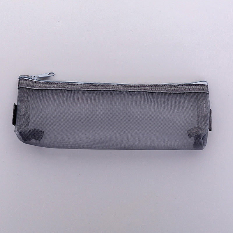 Small white mesh pencil case on table