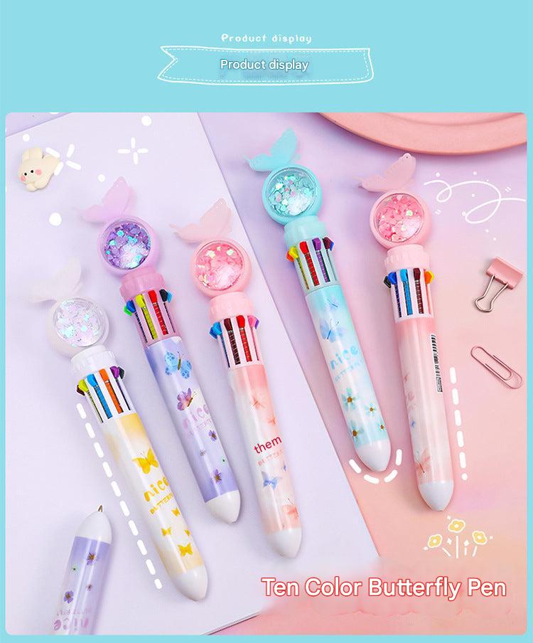 Girl colouring with multicolor ballpoint pen