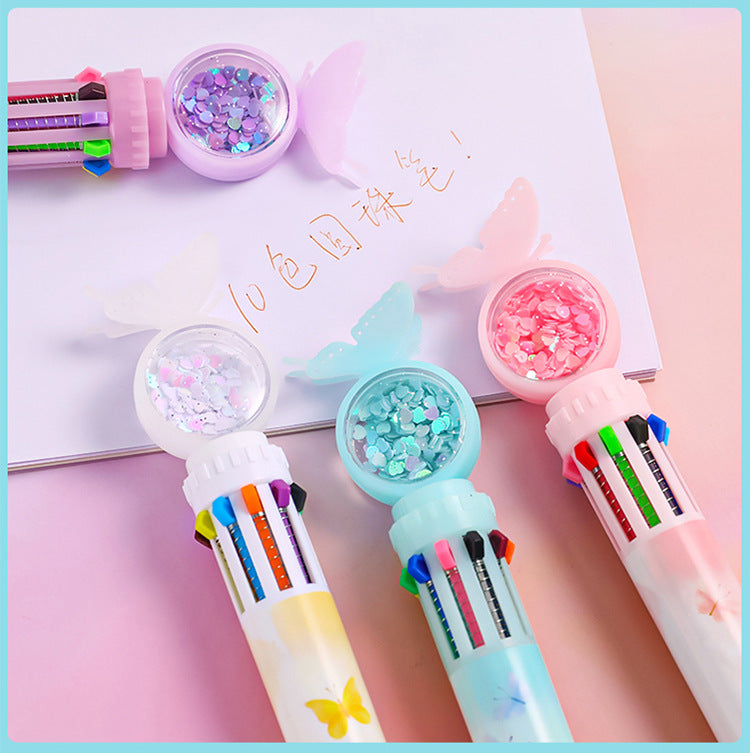 Multicolor ballpoint pen in pink colour display