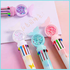 Multicolor ballpoint pen in pink colour display