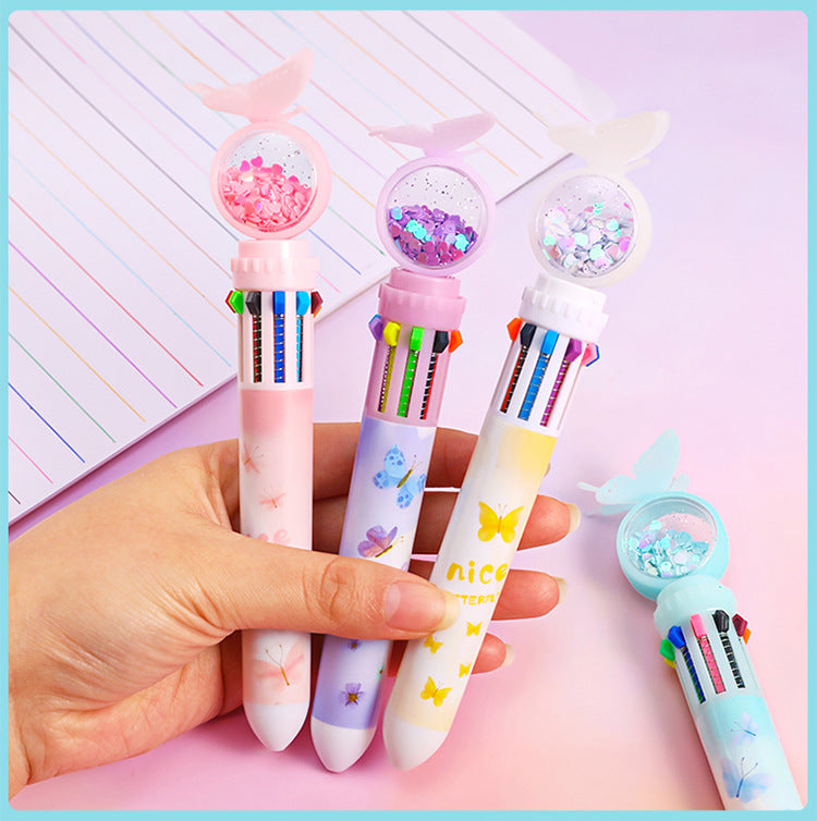 Student using colourful ballpoint pen during exam
