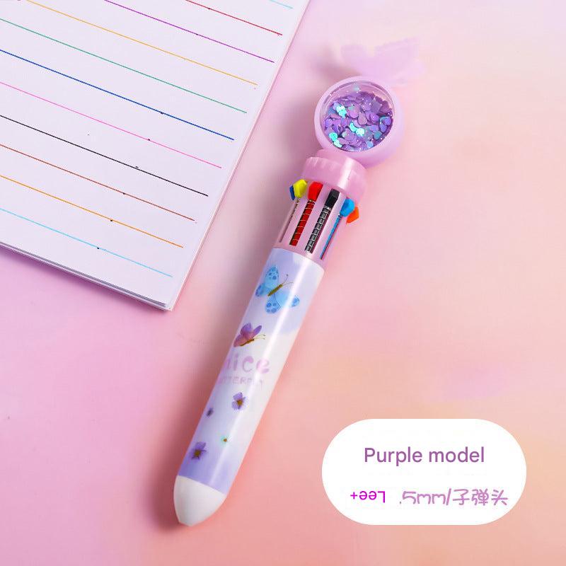 Multicolor ballpoint pen laid on test paper