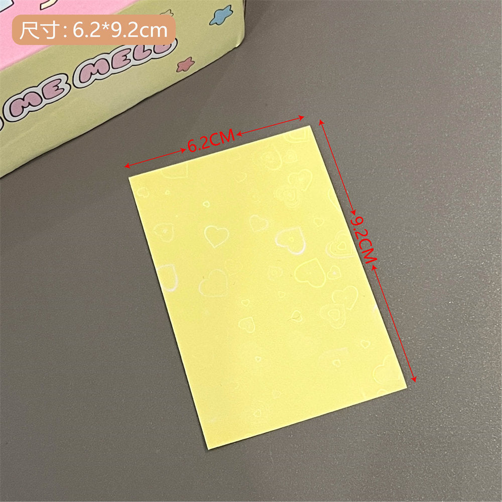 Close-up of macaron photo cards in protective sleeves
