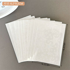 Close-up of macaron photo cards in protective sleeves