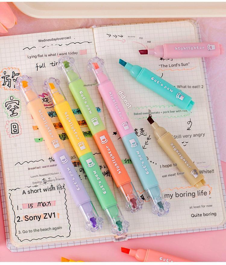student using cat paw highlighters in class