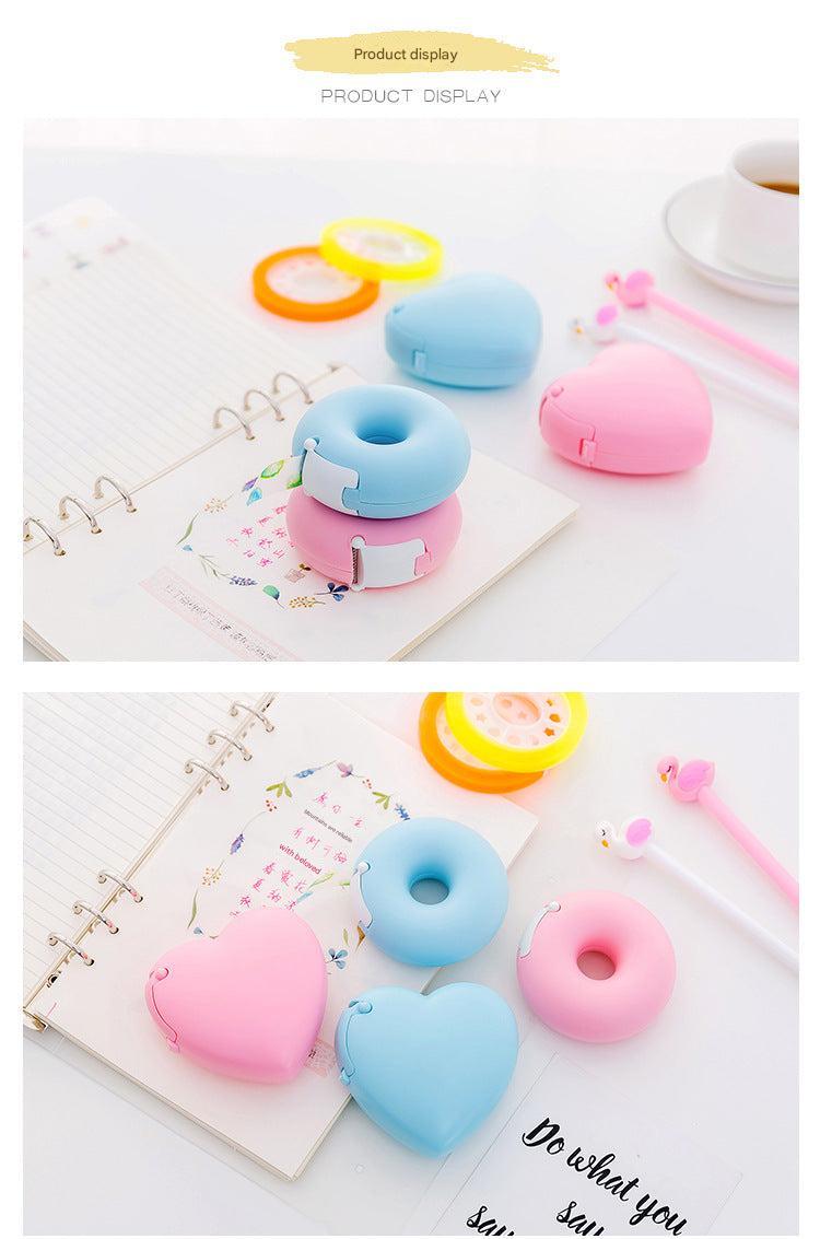 blue donut tape dispenser on desk
