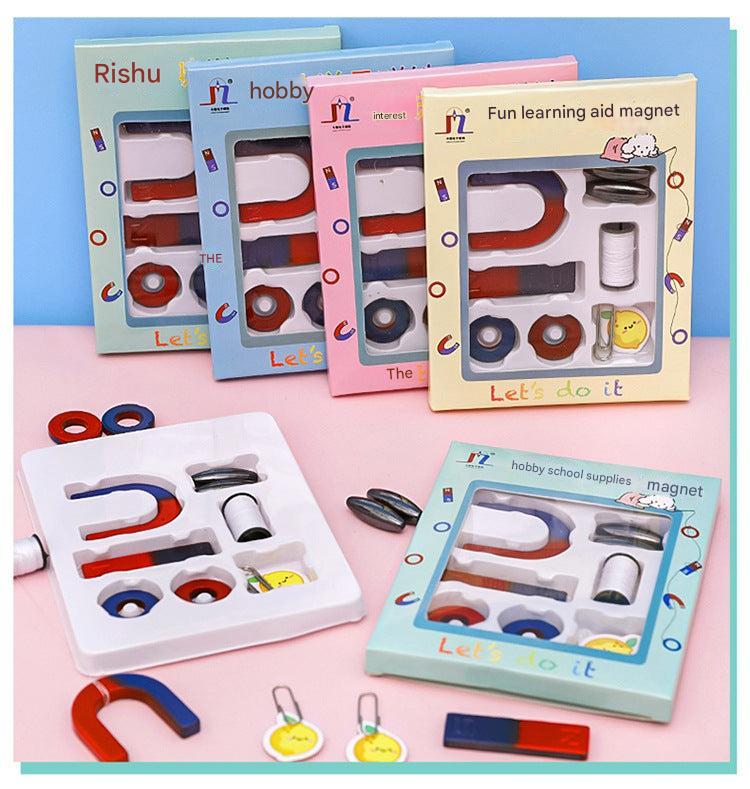 Children exploring magnetism with educational kit