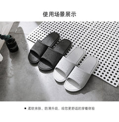 Couple's matching grey slippers displayed