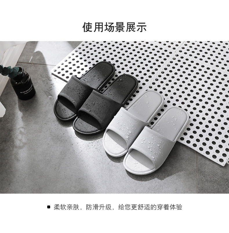 Couple's matching grey slippers displayed
