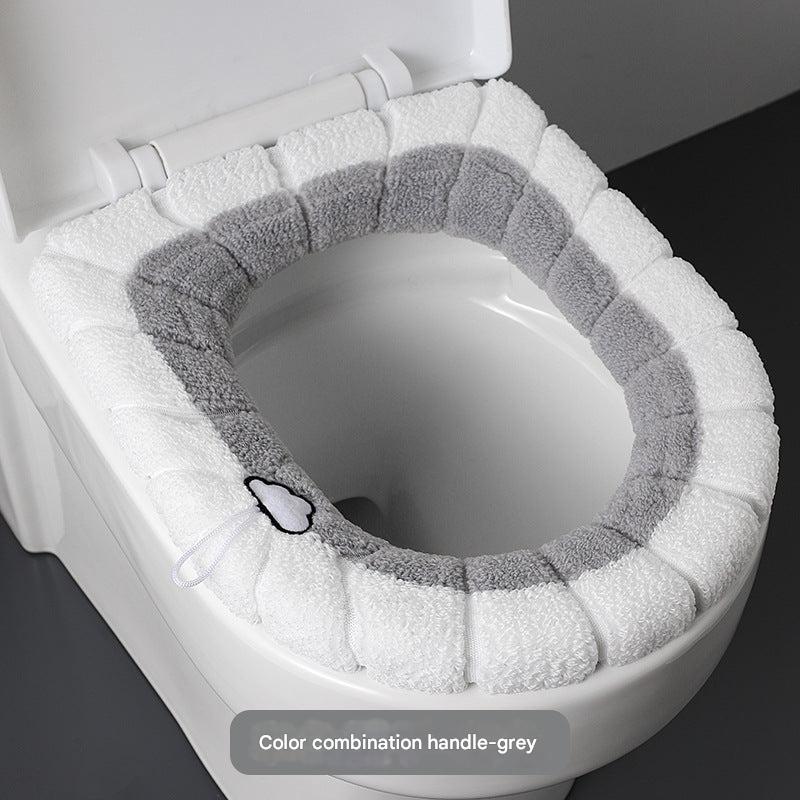 Grey plush toilet cover displayed in a bathroom setting