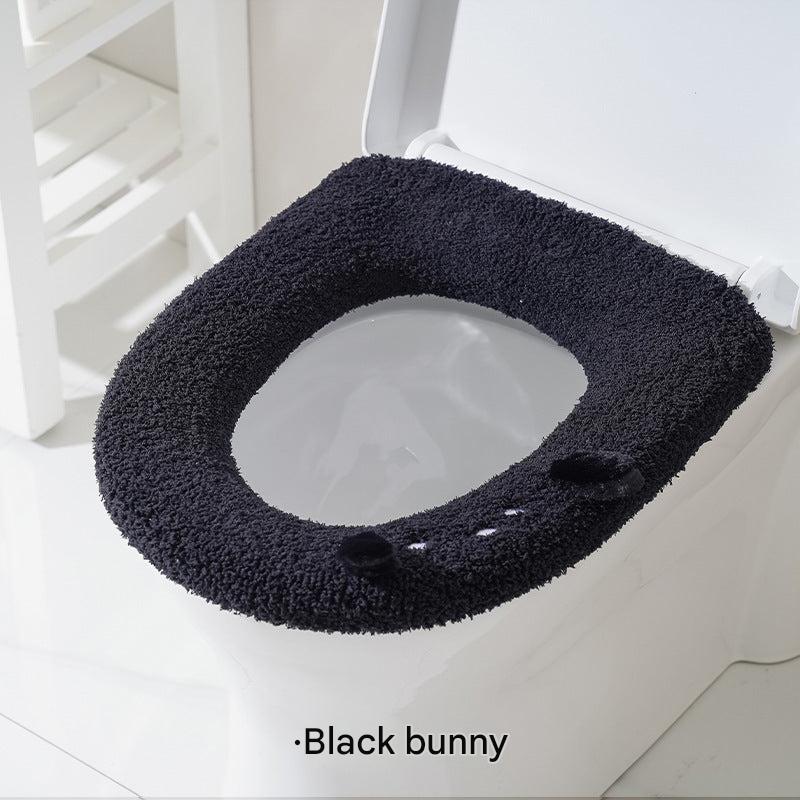 Plush toilet seat cover showcasing pink design