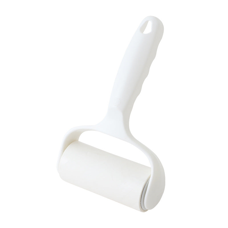 pink lint roller in a bag for travel