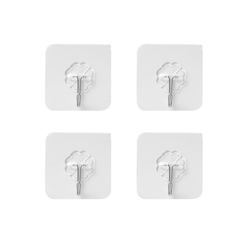 Different sizes of adhesive hooks on a white background