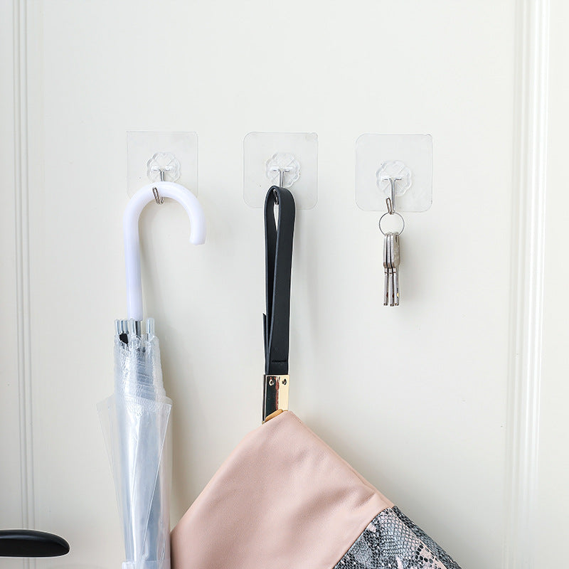 clear wall hook holding bathroom towel