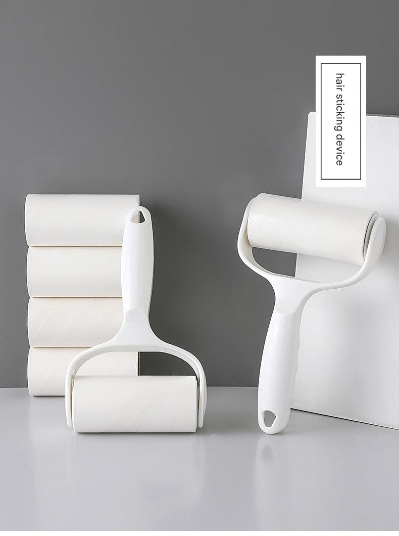 Stylish lint roller close-up on shelves