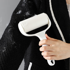 Using a lint roller on clothing