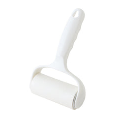Lint roller displaying sticky sheets feature