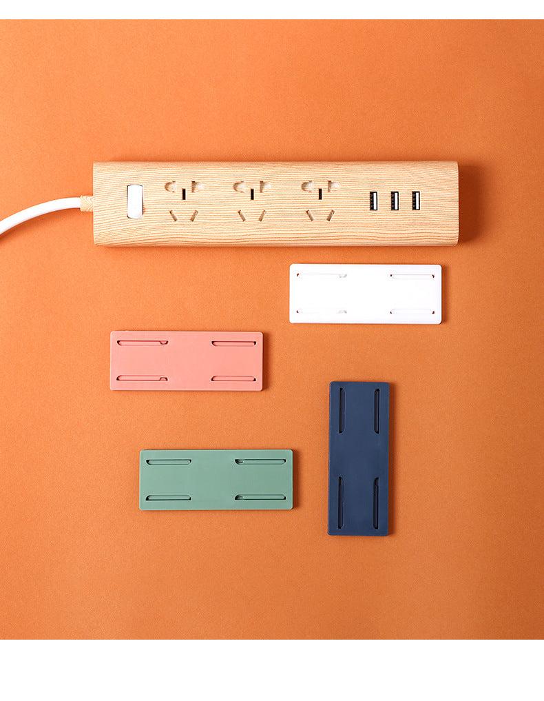 collection of colourful power strip holders and accessories
