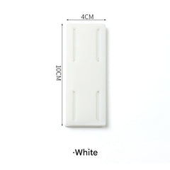 various colors of power strip holders in room setting