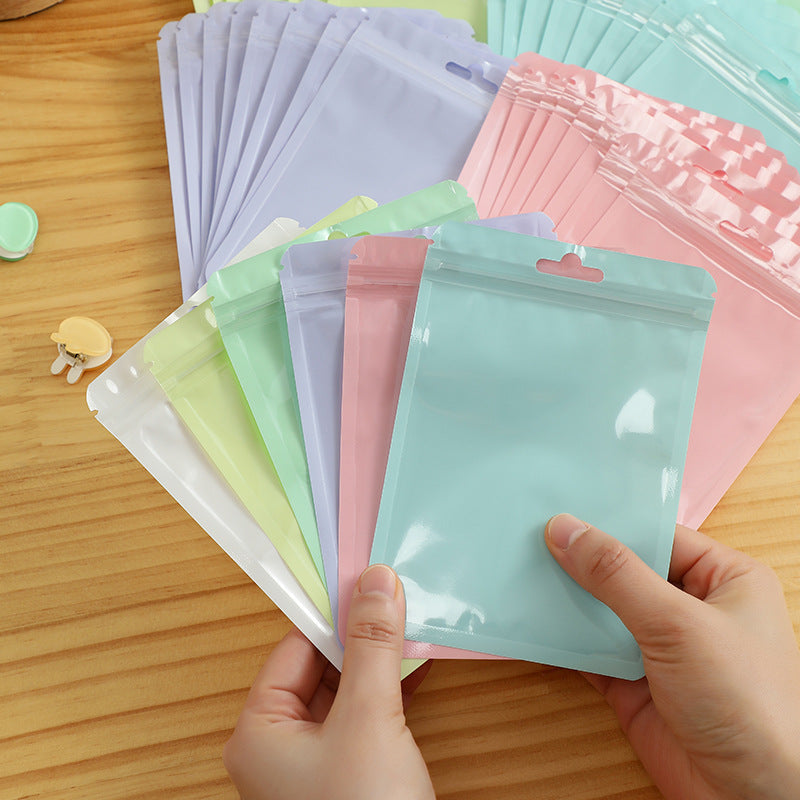 various macaron coloured bags stacked neatly