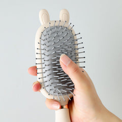 Close-up of the scalp massager feature on hair brush
