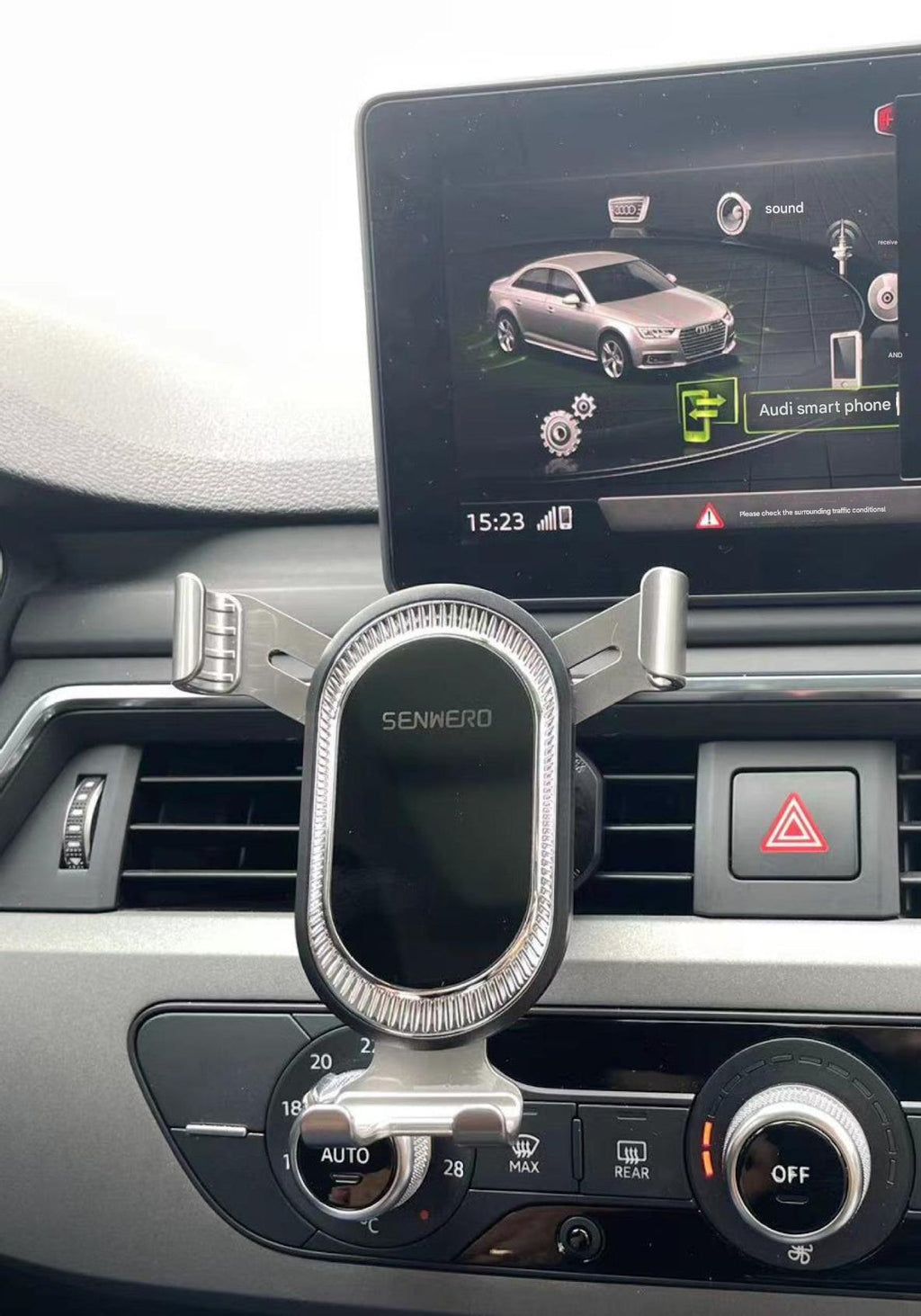 User interacting with smartphone in car phone mount
