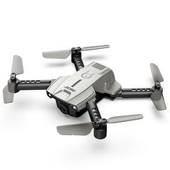 Family enjoying remote control flying with mini drone