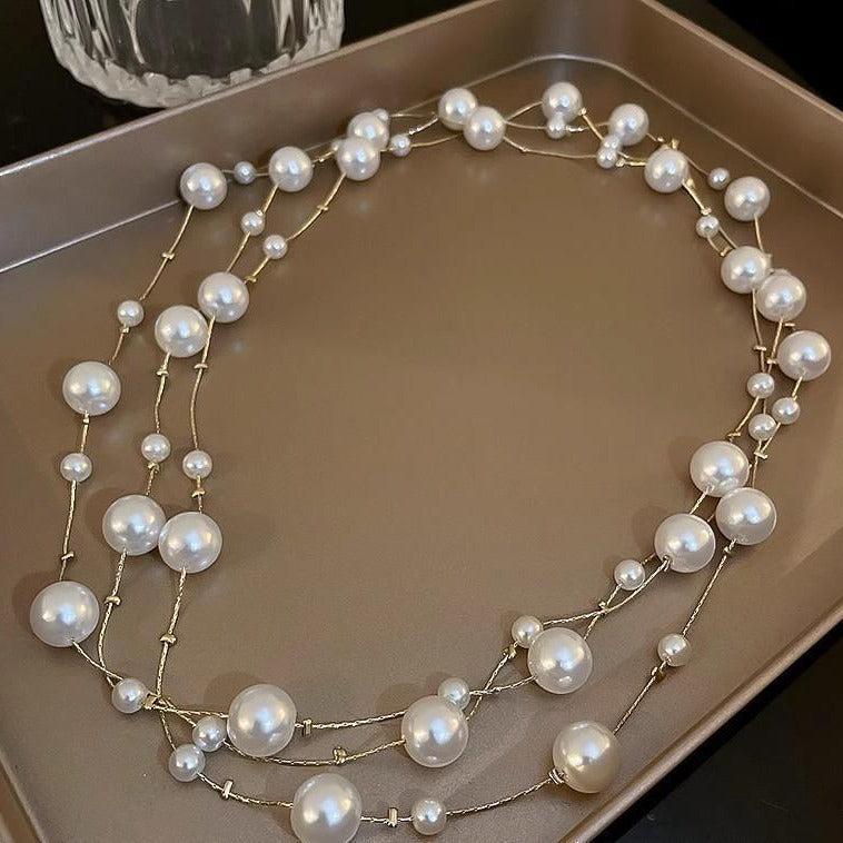 stylish long pearl necklace on mannequin