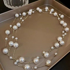 stylish long pearl necklace on mannequin