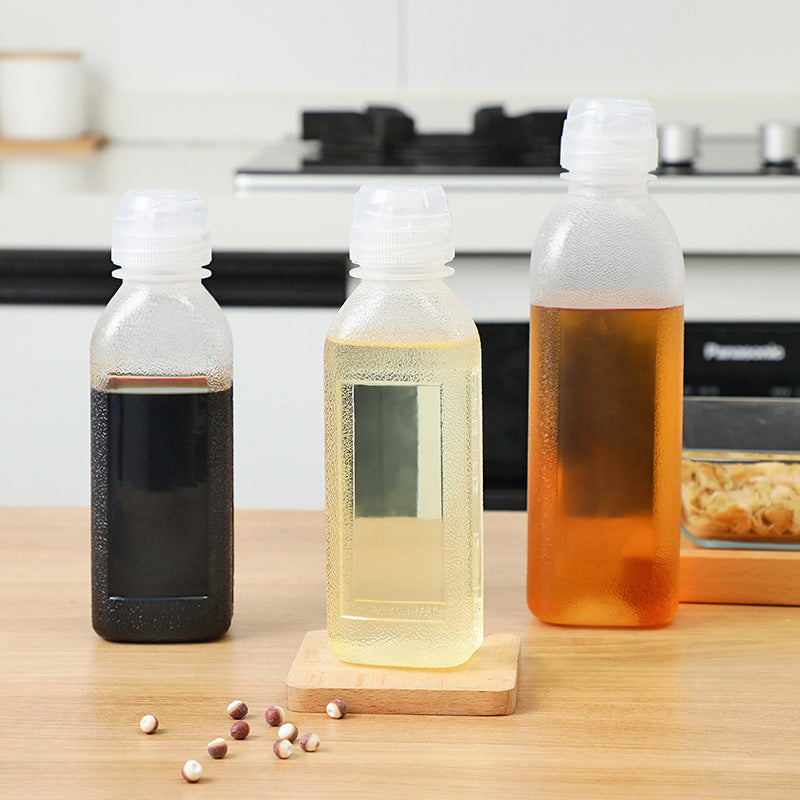 Side view of kitchen squeeze oil dispenser