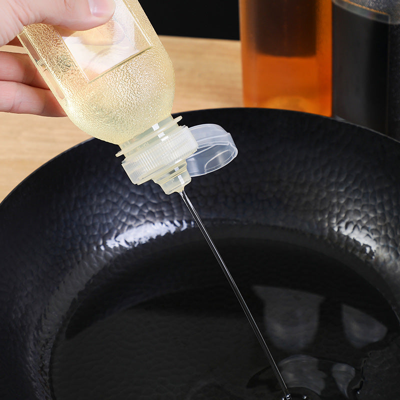 Squeeze oil dispenser for condiments in use