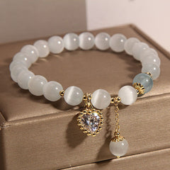 Variety of stylish cat eye stone bracelets displayed