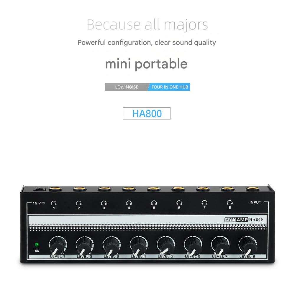 User adjusting controls on HA800 headphone amplifier