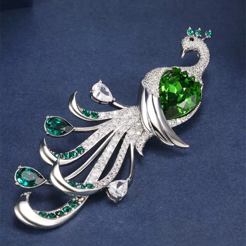 Close-up of intricate peacock design on brooch